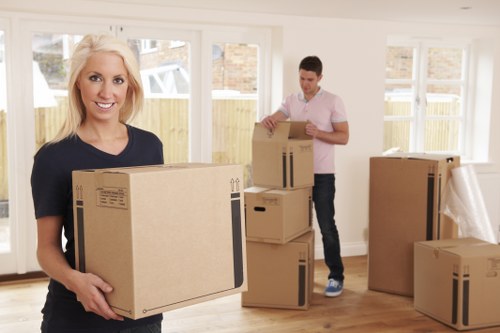Loading furniture and boxes into a van for an Ealing removal job