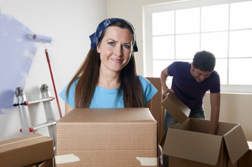 Packed moving boxes and furniture prepared for transport in West London