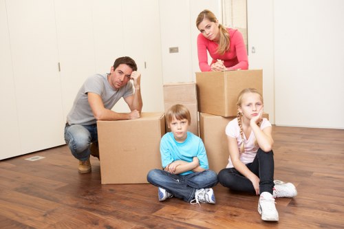 Unpacking boxes into a new Ealing home after relocation