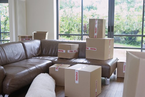 Furniture and boxes being loaded into a moving van in Ealing